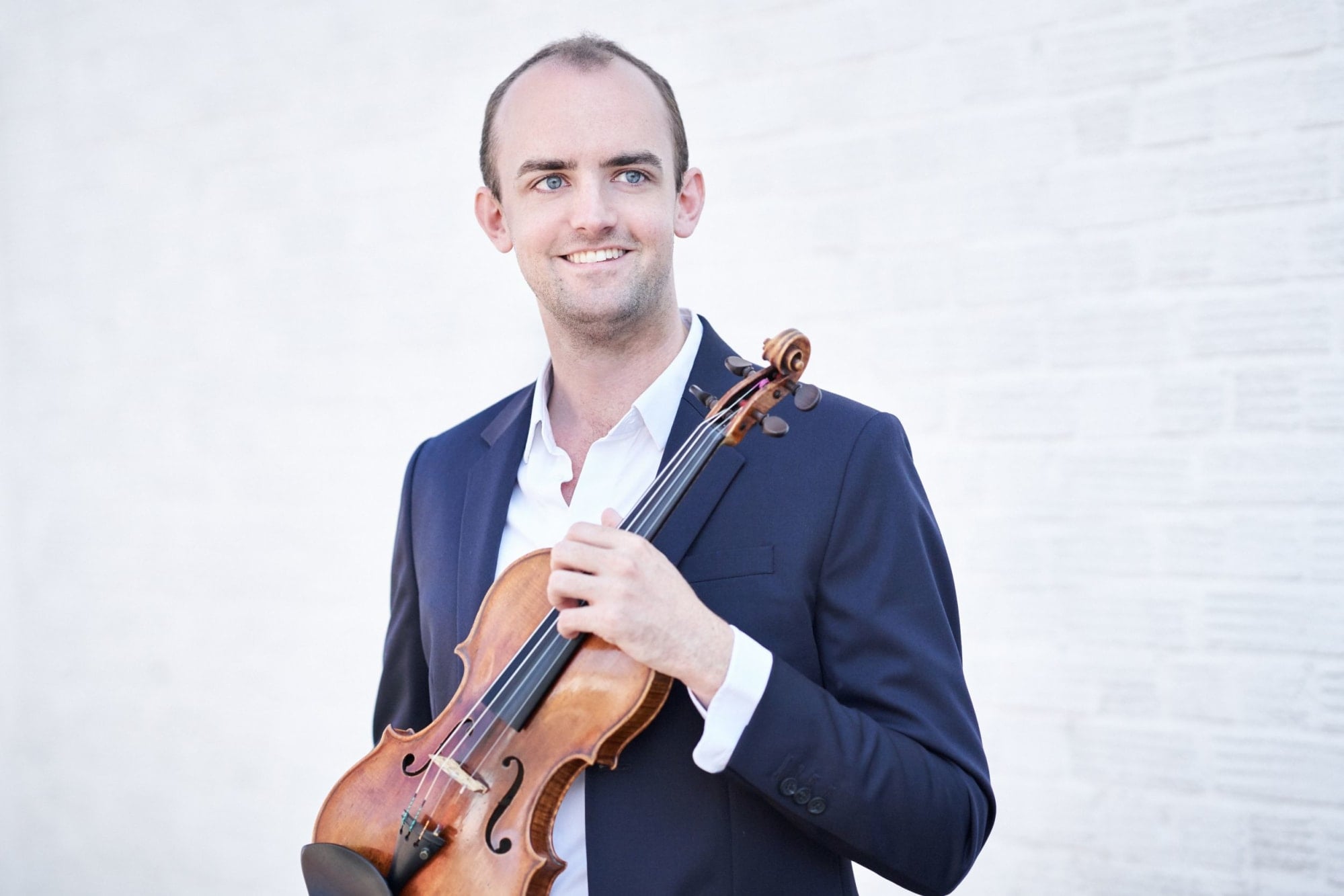 Benjamin Baker holding his violin